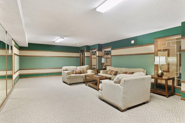 living room featuring carpet flooring, baseboard heating, and a textured ceiling