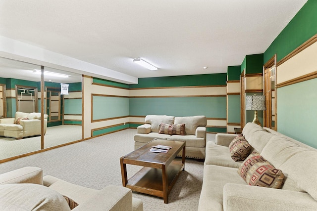 carpeted living room featuring a textured ceiling