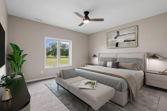 carpeted bedroom featuring visible vents, baseboards, and a ceiling fan