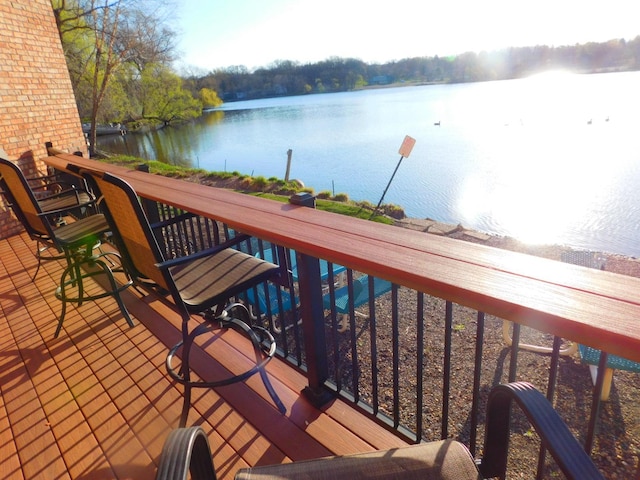 wooden deck with a water view