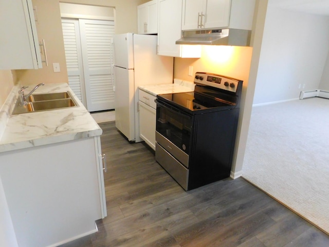 kitchen with range with electric stovetop, sink, white cabinets, and white refrigerator