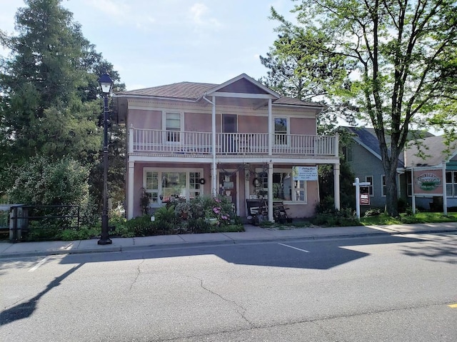 view of front of home with a balcony