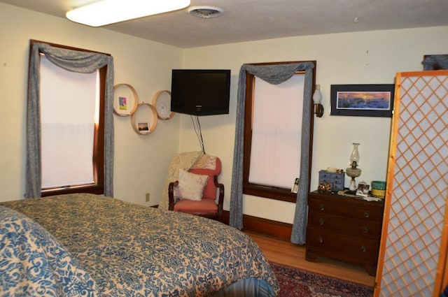 bedroom featuring wood-type flooring