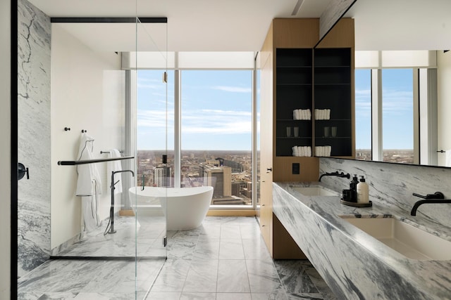 bathroom featuring plenty of natural light, decorative backsplash, and a tub to relax in