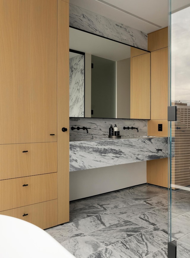 bathroom with beamed ceiling, vanity, and tasteful backsplash