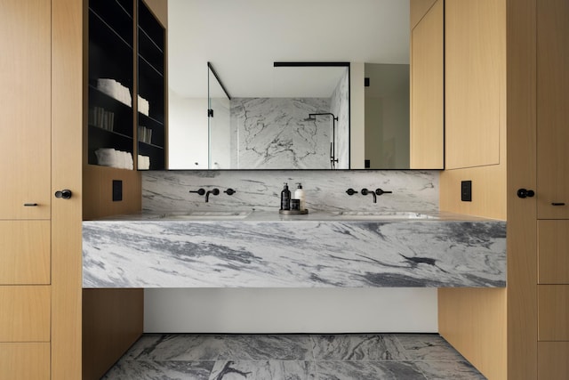 bathroom featuring decorative backsplash and vanity