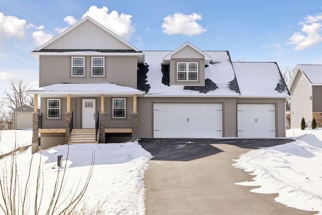 view of front of property featuring a porch and a garage