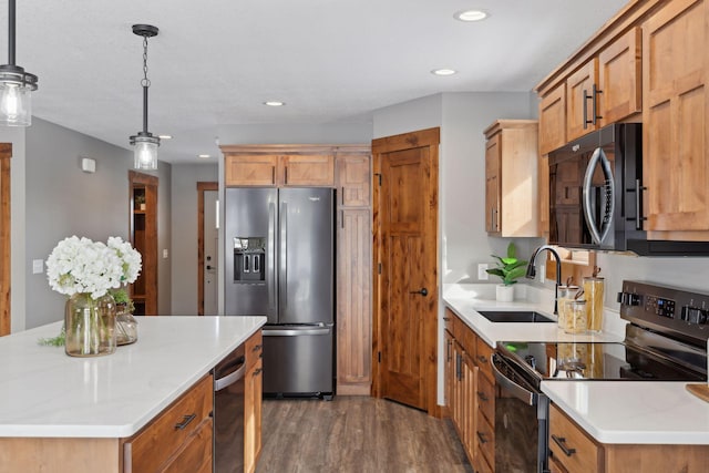 kitchen featuring sink, hanging light fixtures, range with electric stovetop, stainless steel fridge, and dark hardwood / wood-style flooring