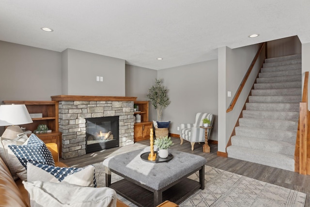 living room featuring a fireplace and light wood-type flooring