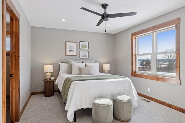 carpeted bedroom with ceiling fan