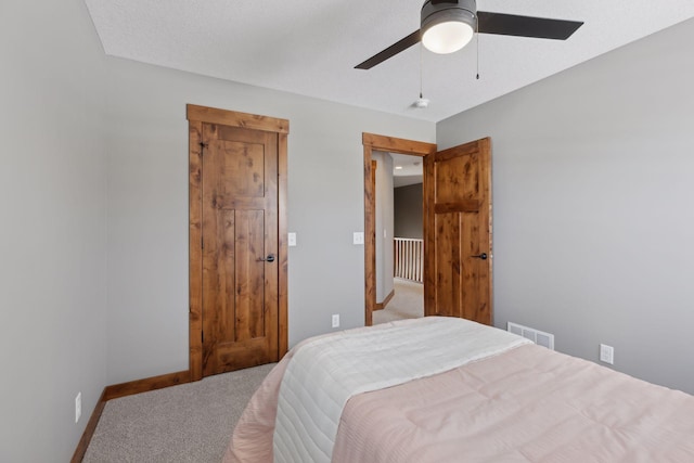 carpeted bedroom featuring ceiling fan