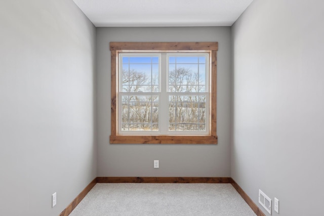 unfurnished room with carpet floors