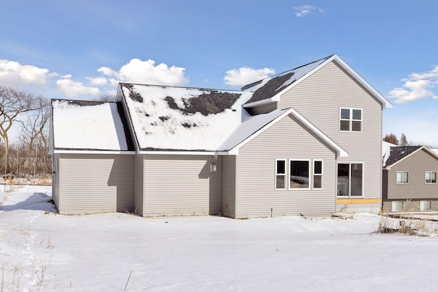 view of snow covered house