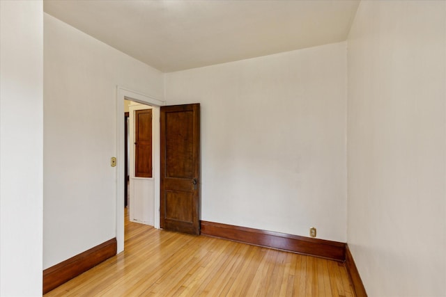 spare room featuring light hardwood / wood-style floors