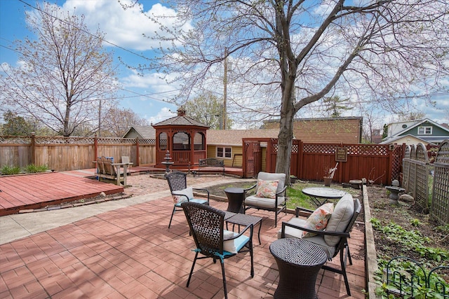 view of patio with outdoor lounge area, a gazebo, and a deck