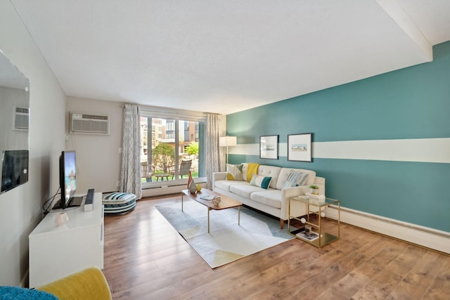 living room featuring an AC wall unit, wood-type flooring, and baseboard heating