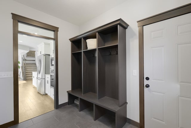 mudroom featuring dark wood-type flooring