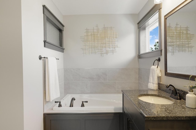 bathroom with vanity and a bathtub