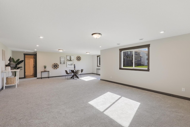 exercise area featuring light carpet