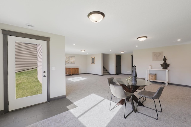 dining area featuring light colored carpet