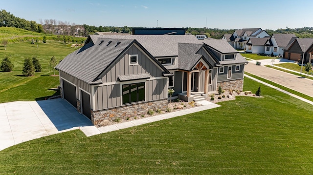 view of front of house featuring a front lawn and a garage