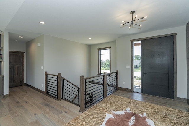 3185 Bella Terra Ln NE, Rochester, MN 55906 - entrance foyer with a chandelier, wood finished floors, baseboards, and recessed lighting