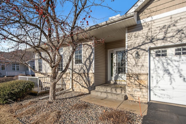 entrance to property featuring a garage