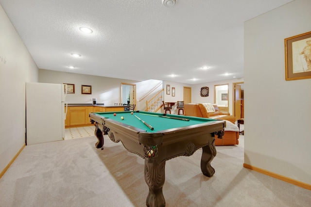 playroom featuring light carpet, a textured ceiling, and billiards