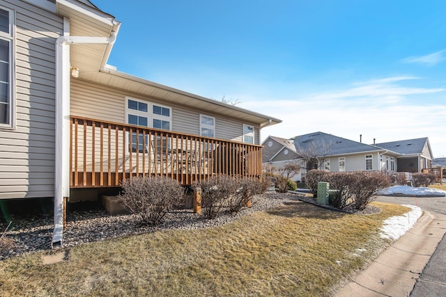 exterior space featuring a lawn and a deck