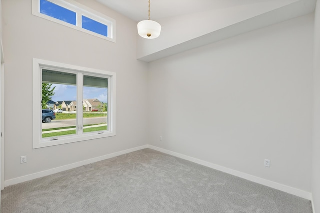 unfurnished room with carpet floors