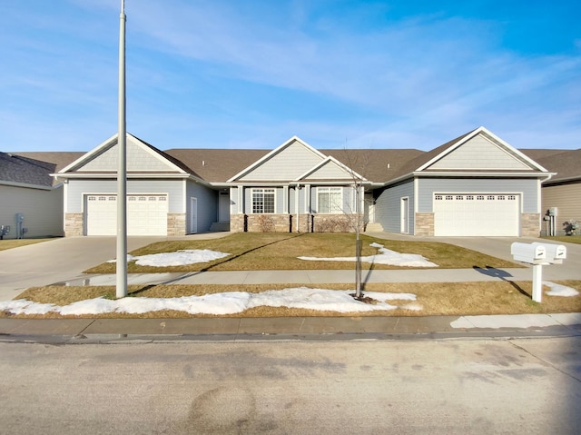 view of front of house with a front yard and a garage