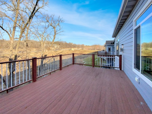 wooden terrace featuring a rural view