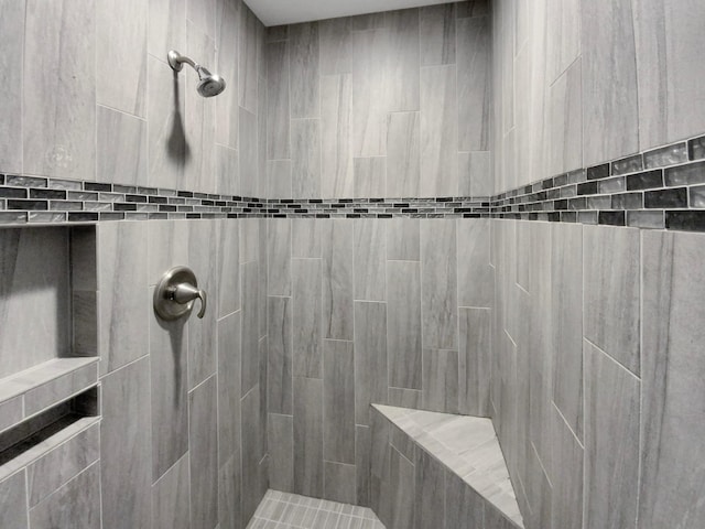 bathroom featuring tiled shower