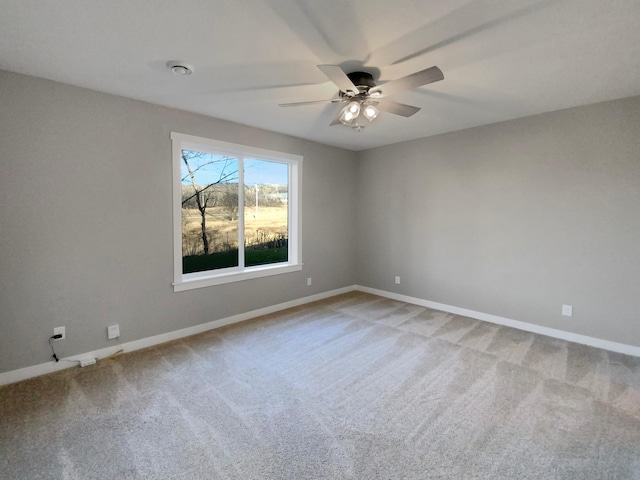 empty room with carpet flooring and ceiling fan