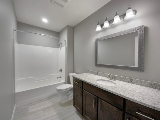 full bathroom featuring vanity, shower / bathing tub combination, and toilet