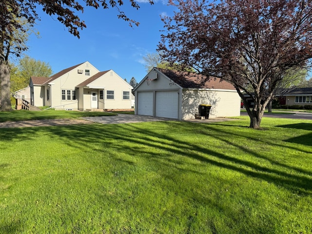 view of front of house with a garage and a front yard