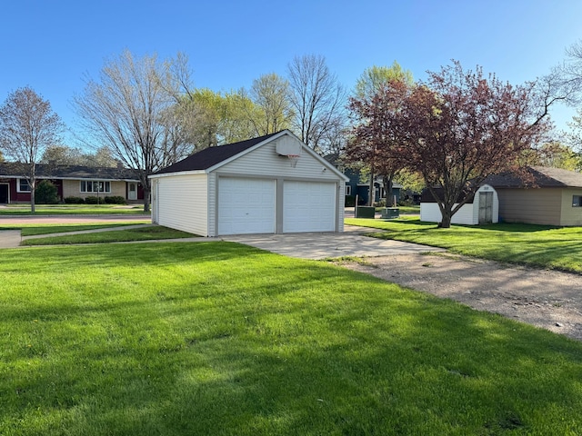 garage featuring a lawn