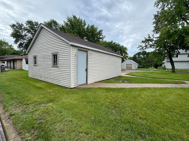 view of outbuilding with a lawn