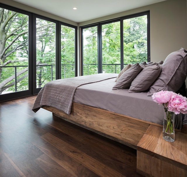 bedroom with recessed lighting and wood finished floors