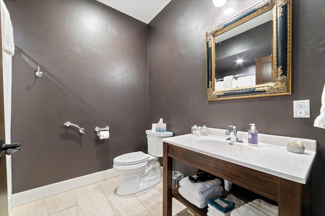 bathroom featuring toilet and sink