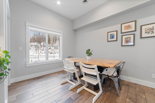 dining area with hardwood / wood-style floors