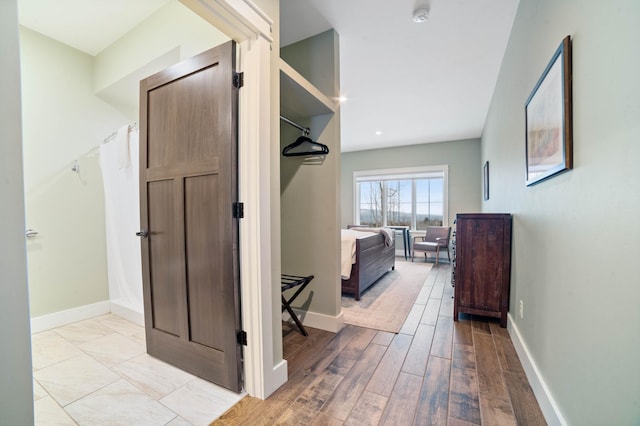 hall with light wood-type flooring