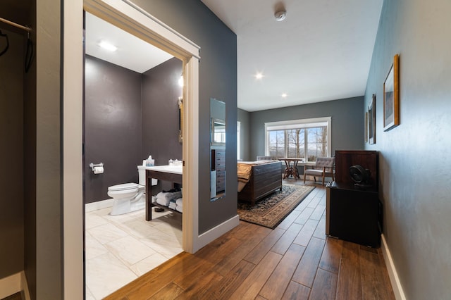 corridor featuring light hardwood / wood-style flooring