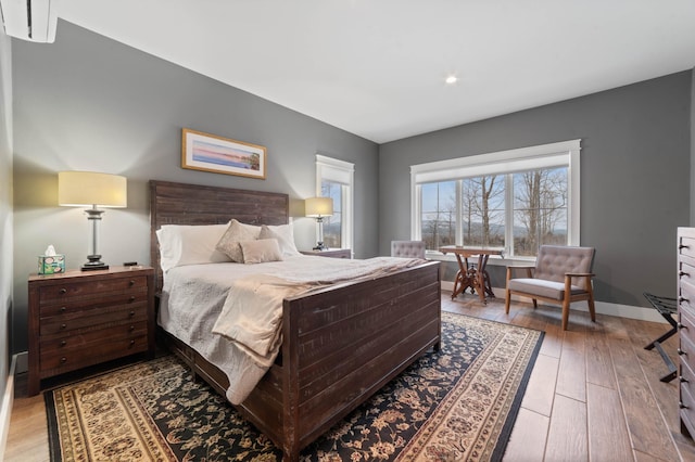 bedroom with hardwood / wood-style floors