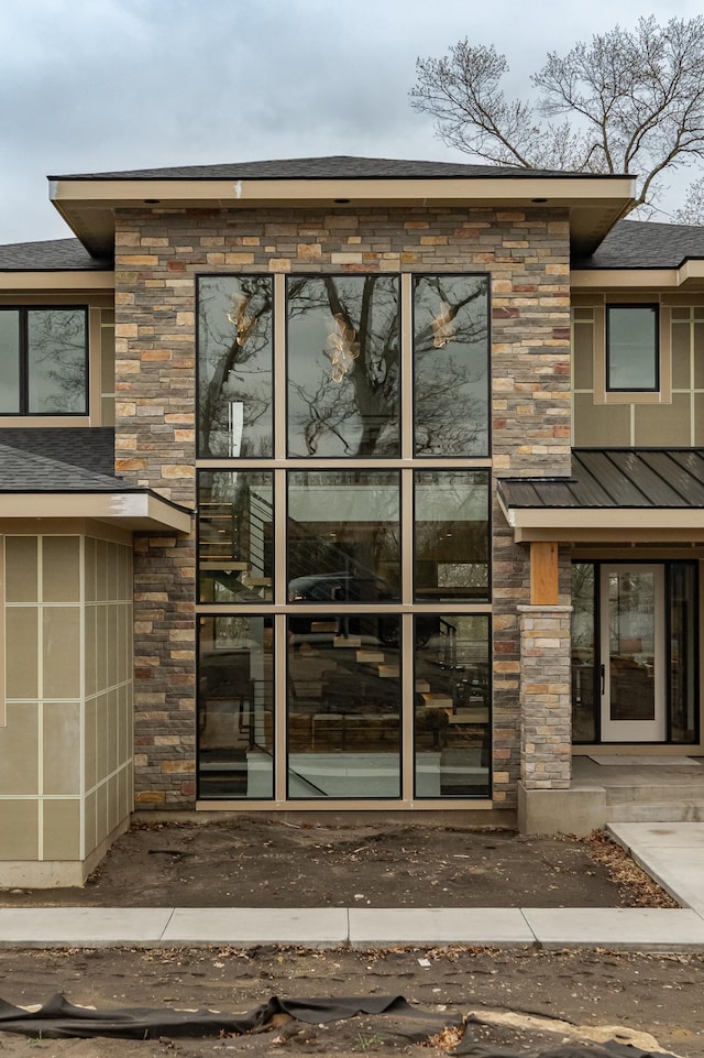 4163 Christopherson Ln SW, Rochester, MN 55902 - view of exterior entry with stone siding, a standing seam roof, and metal roof