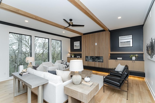 4163 Christopherson Ln SW, Rochester, MN 55902 - living room with beamed ceiling, ceiling fan, light wood-style flooring, recessed lighting, and a glass covered fireplace