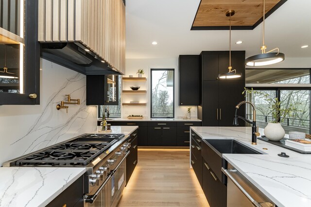 4163 Christopherson Ln SW, Rochester, MN 55902 - kitchen with dark cabinets, plenty of natural light, stovetop, a sink, and recessed lighting