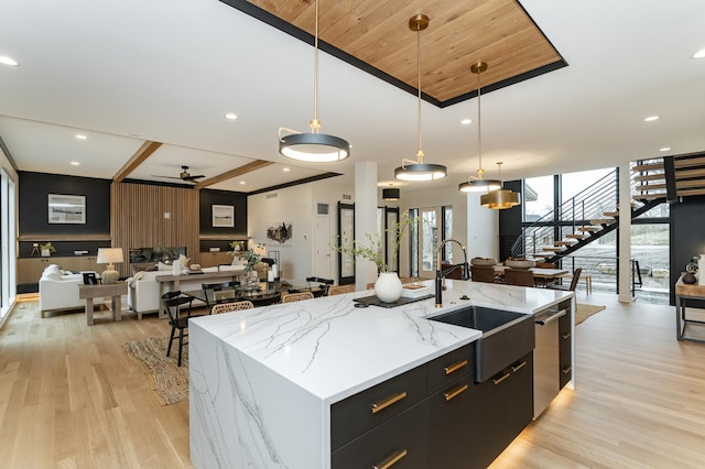 4163 Christopherson Ln SW, Rochester, MN 55902 - kitchen with a sink, open floor plan, dark cabinetry, modern cabinets, and light wood-style flooring