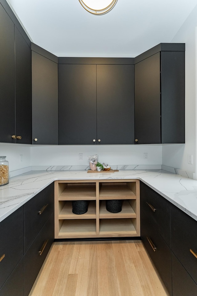 4163 Christopherson Ln SW, Rochester, MN 55902 - kitchen featuring dark cabinetry, light wood-type flooring, modern cabinets, and open shelves