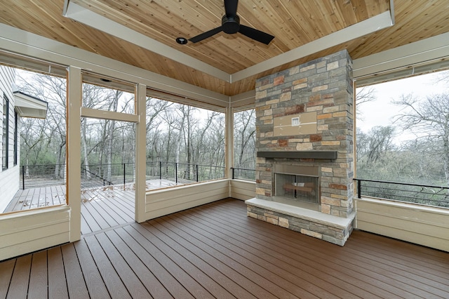 4163 Christopherson Ln SW, Rochester, MN 55902 - unfurnished sunroom featuring an outdoor stone fireplace and a ceiling fan